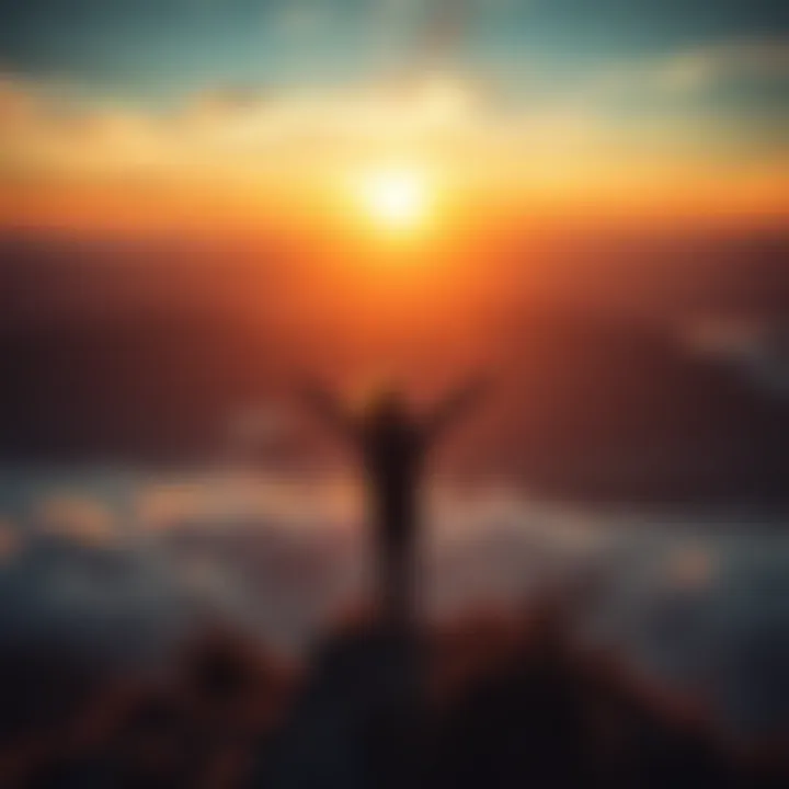 A person standing on a hilltop with arms raised, enjoying a sunset, symbolizing achievement and dreams