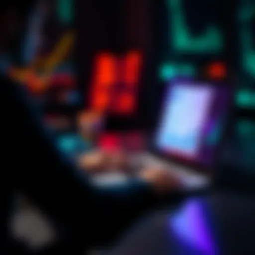 A person analyzing monthly financial data on a laptop, with graphs and charts visible on the screen