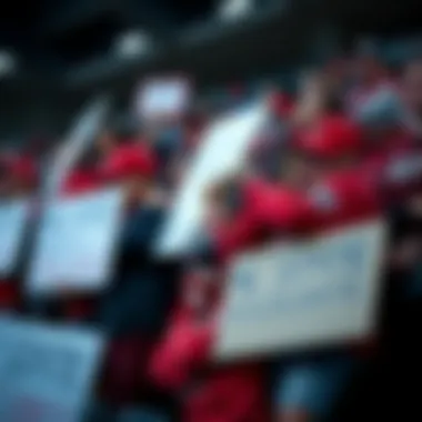 NC State Fans in Disappointment NC State fans showing sadness and disappointment after a recent sports loss, some holding signs and wearing team gear