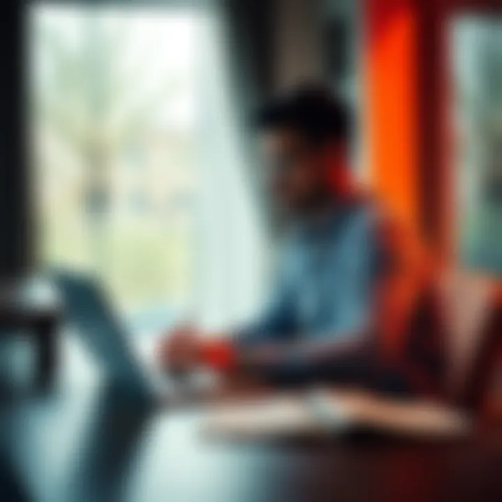 A person sitting at a table with a laptop, looking hopeful while writing a plan for financial recovery after a gambling loss.