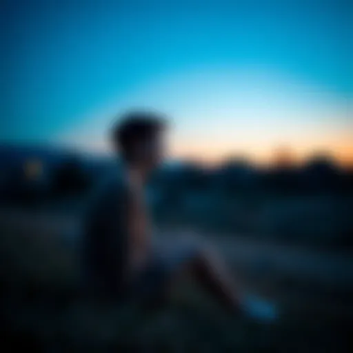A person sitting in a peaceful setting, looking thoughtful while gazing into the distance, symbolizing the concept of intuition and future insights.