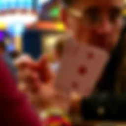 A poker player with Ace-King hand focusing on his cards during a tense moment in the WSOP main event.