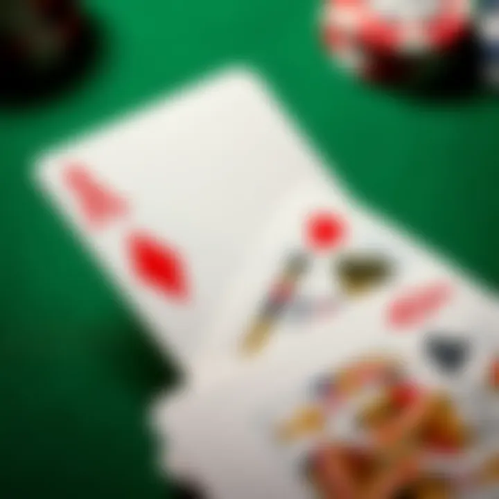 A close-up view of three playing cards showing the Blackjack hand, featuring two Aces and a King, on a green felt table.